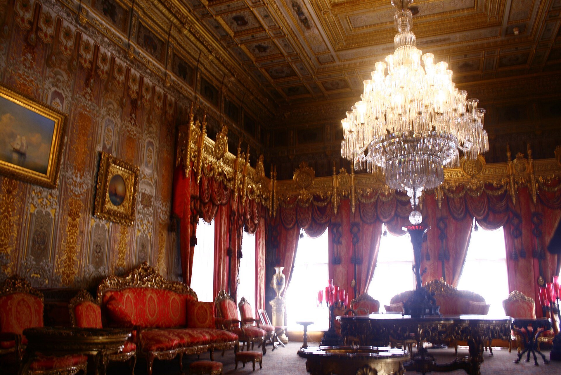 The Süfera Hall of Dolmabahçe Palace, with a large chandelier, gilded walls and a patterned carpet
